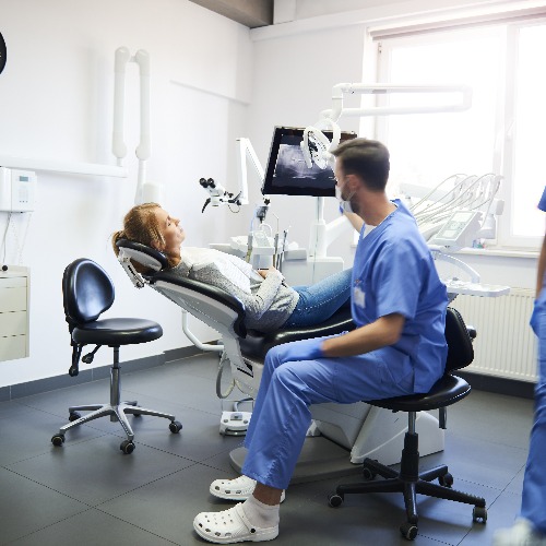 Blurred view of busy dentists at work jpg